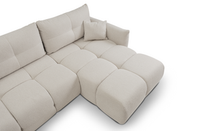 Divano letto angolare in tessuto bouclè Dublino 257x111/177 cm