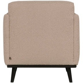 Poltrona in tessuto bouclé con braccioli Statement 72x77 cm