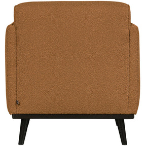 Poltrona in tessuto bouclé con braccioli Statement 72x77 cm