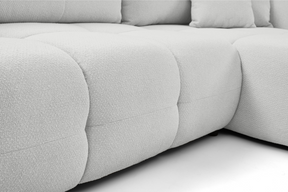 Divano letto angolare in tessuto bouclè Dublino 257x111/177 cm