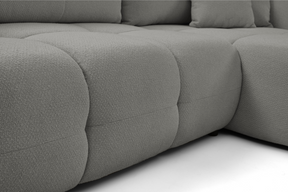 Divano letto angolare in tessuto bouclè Dublino 257x111/177 cm