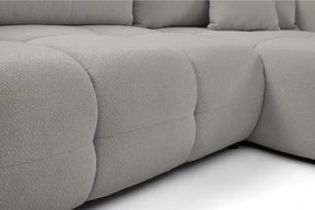 Divano letto angolare in tessuto bouclè Dublino 257x111/177 cm